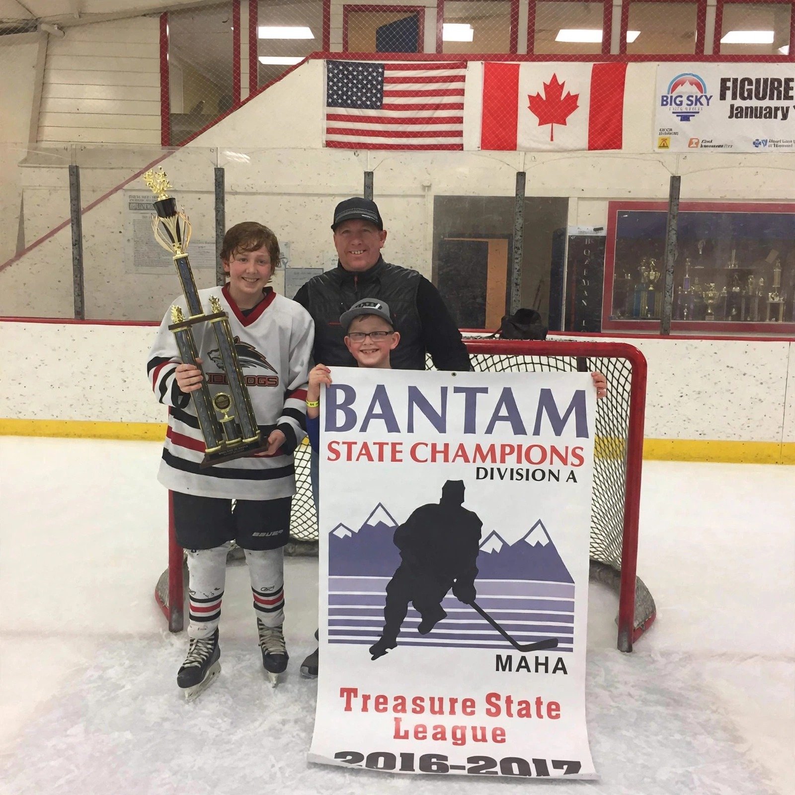 The Miessner family with the Bantam State Champions banner 2016-2017